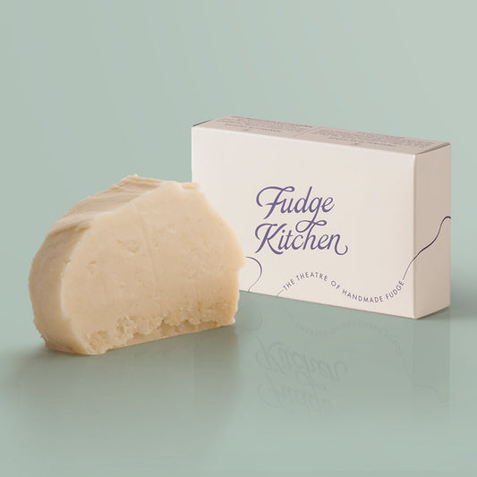 Snowball Vegan Fudge single slice, a Fudge Kitchen indulgent, handmade vegan Fudge flavour displayed with an elegant gift box.